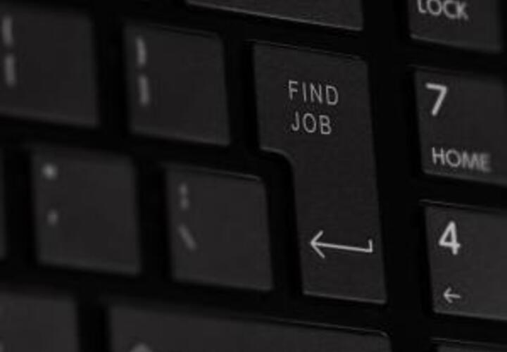A closeup image of the enter key on a key board with the key's text changed with "Find Job" where "enter" would normally be