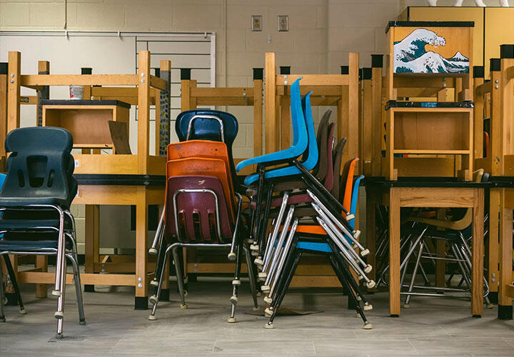 a stack of chairs in a school